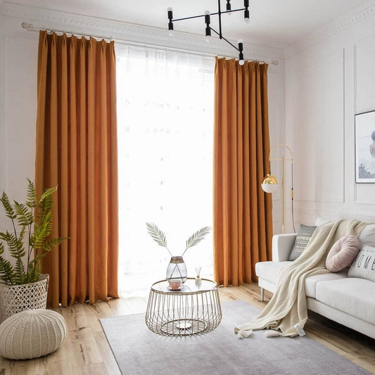 What kind or style of bedroom would be suitable with solid orange curtains?