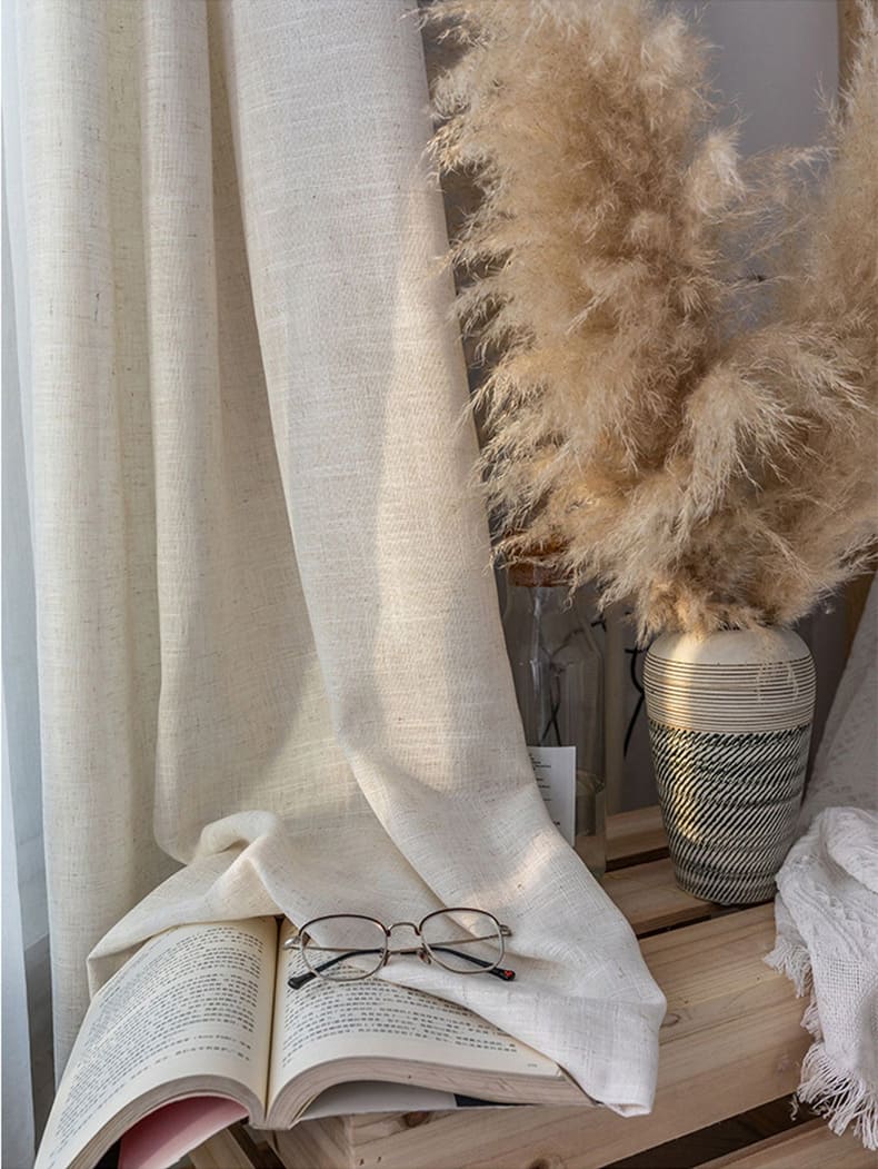Linen curtains gently filtering sunlight to create soft room illumination