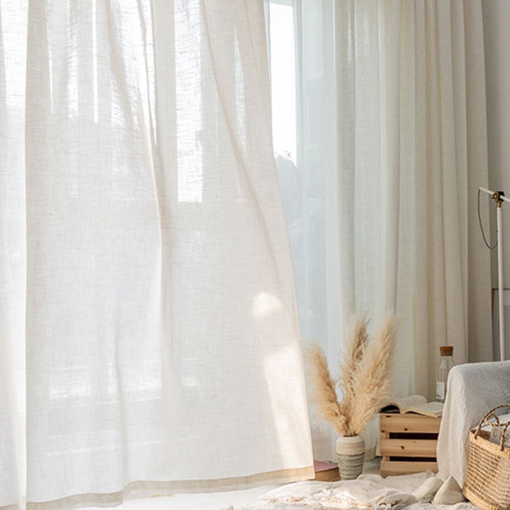 Linen sheer curtains in bedroom providing privacy while diffusing natural light