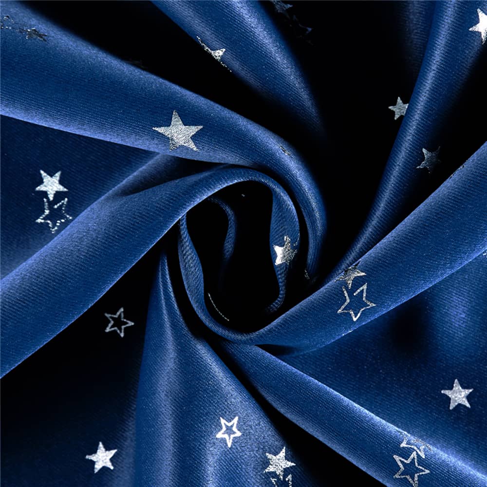 Close-up of silver star pattern on navy balloon curtains, ideal for nursery, children's bedroom or playroom decor.